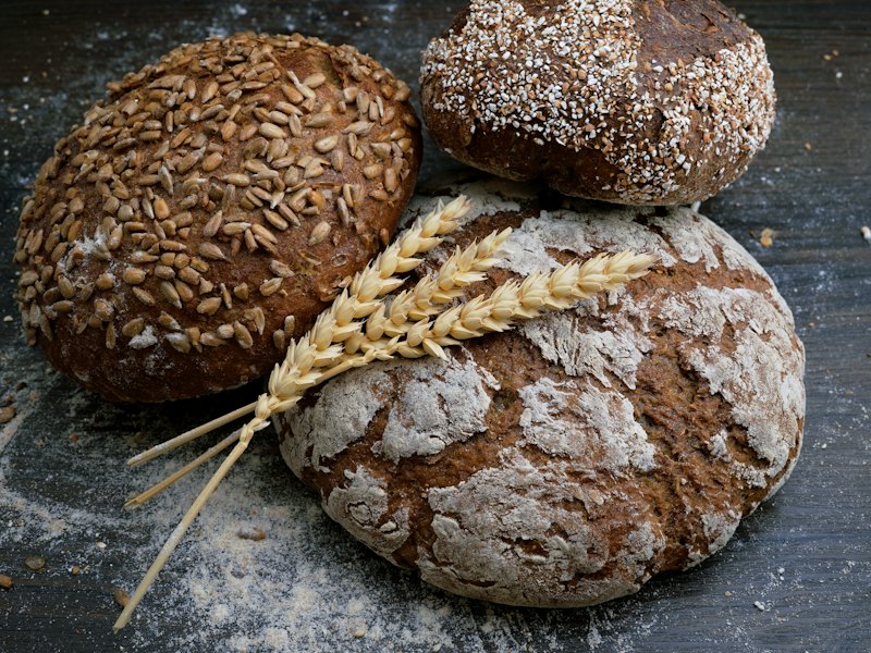 A seeded loaf of bread on a board